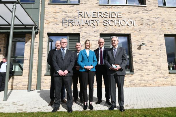 People in front of riverside primary school